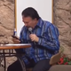 Illustration for article titled This preacher browsing his phone while speaking in tongues speaks volumes